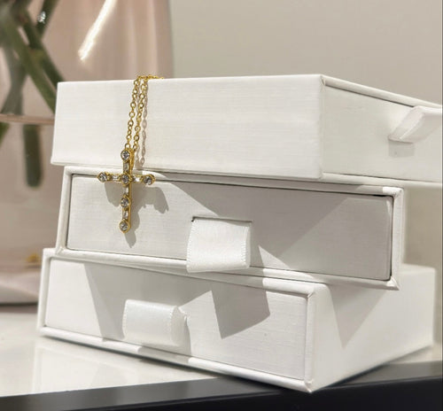 Gold cross necklace. Jewellery box