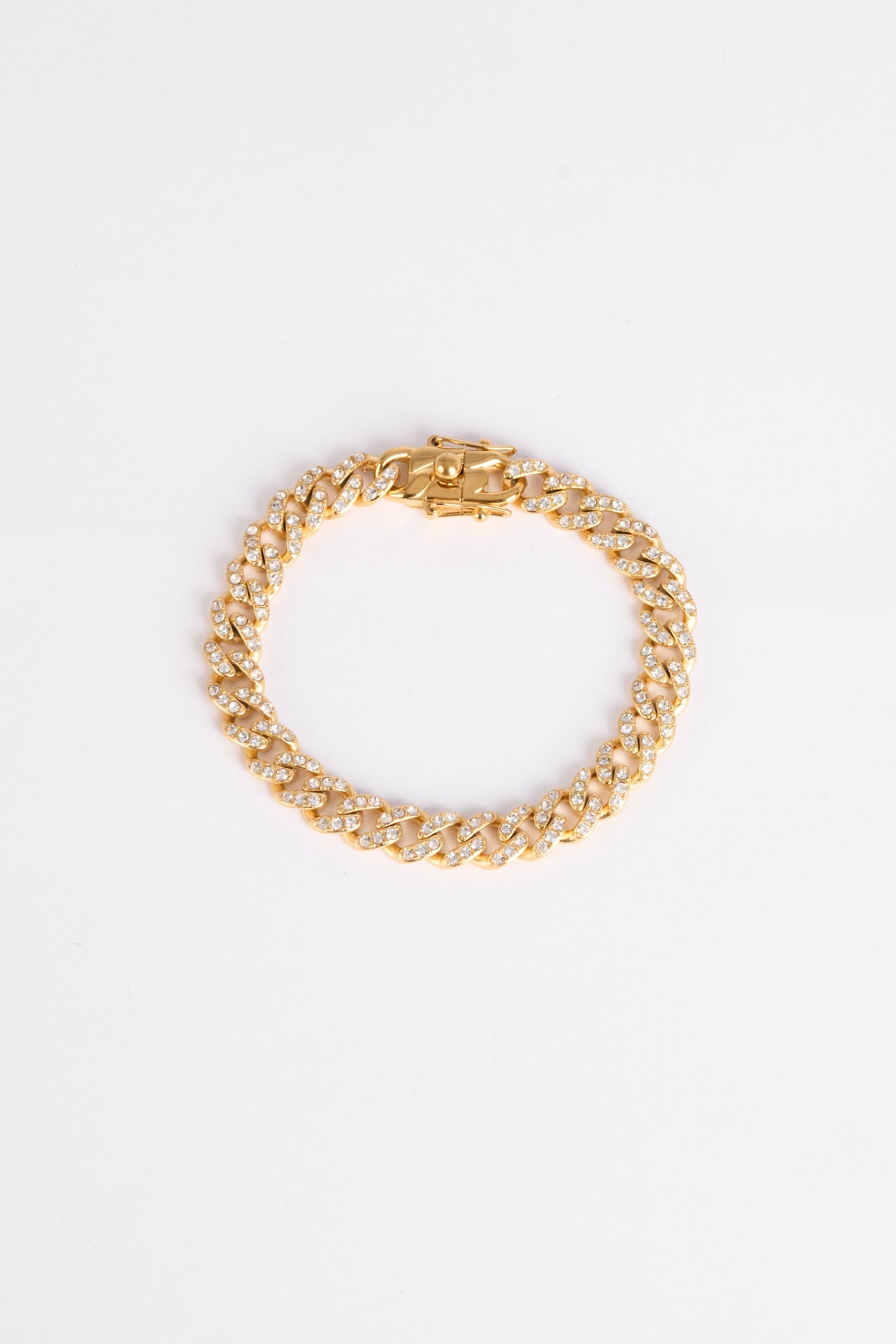 Gold chain bracelet on a white background