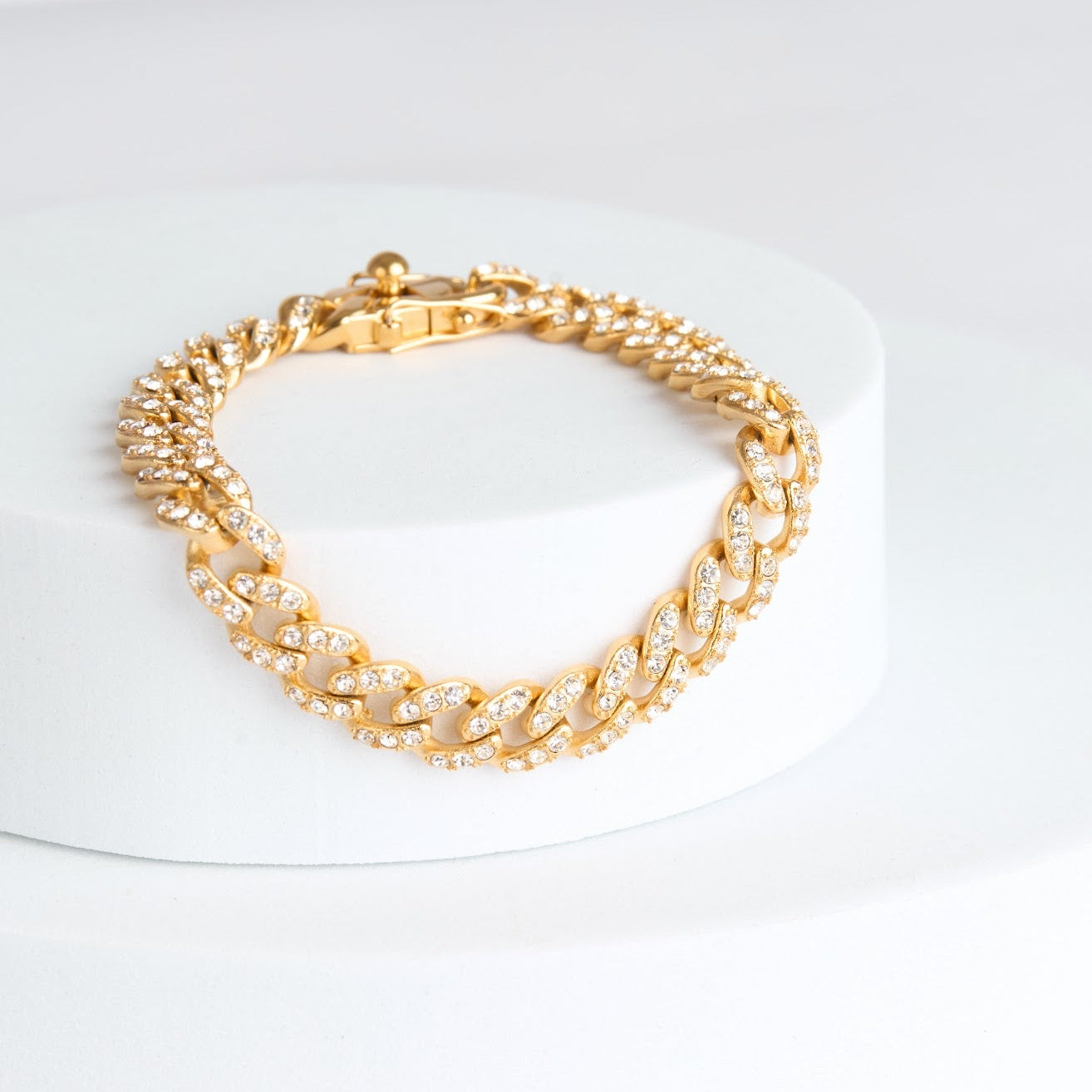 Gold chain bracelet on a white background