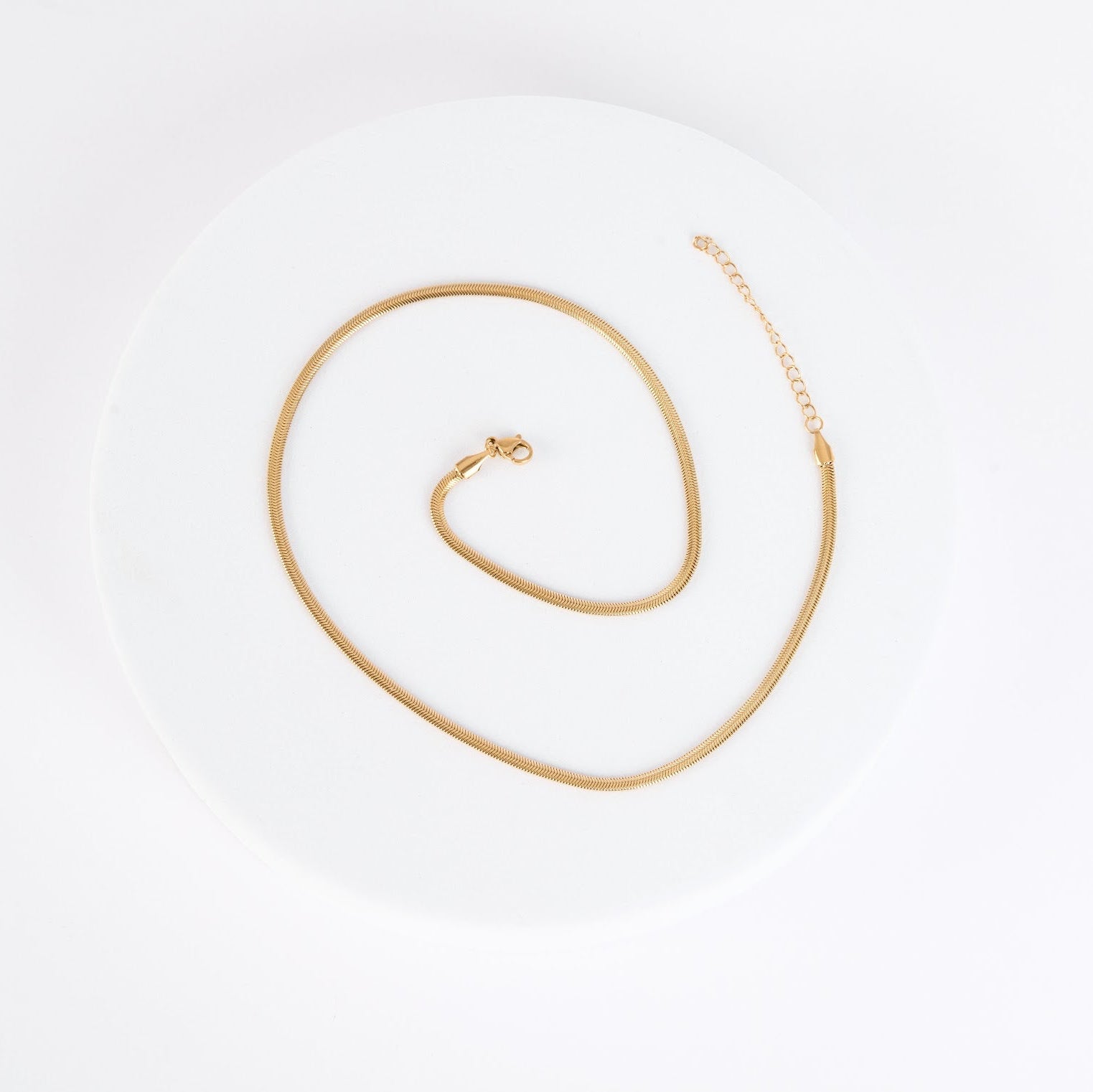 Gold necklace on a white background